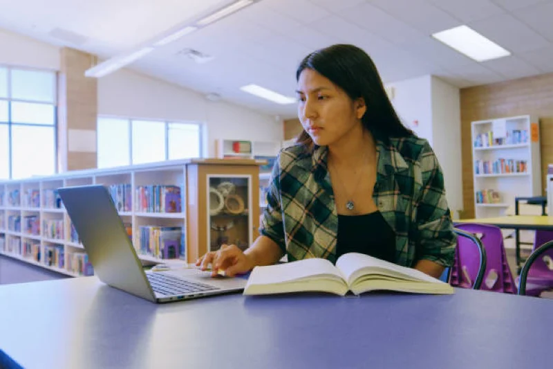 woman at library studying indiginous populations